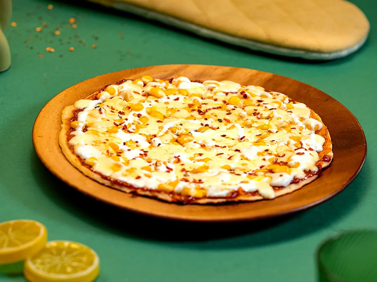 Corn N Cheese Mizza on a wooden board